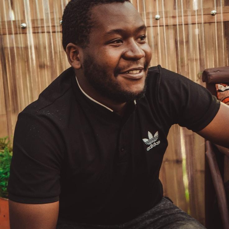 Avery Blake, Lead Design Curator at EchoHarborLane, reviewing corporate floral arrangements